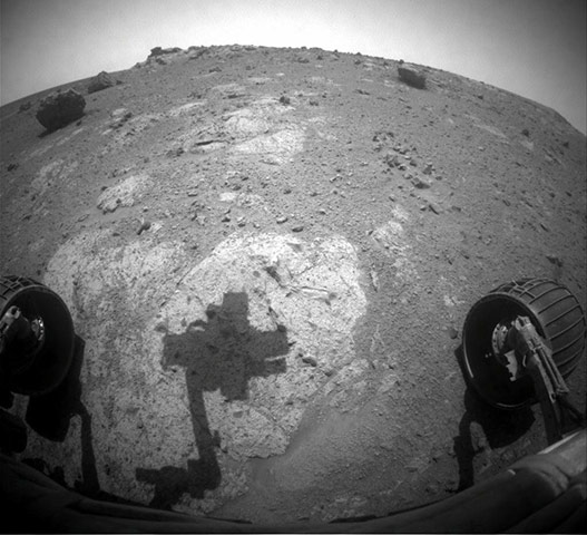 Month in space: robotic arm of NASA's Mars Exploration Rover Opportunity casts a shadow