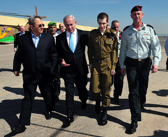Shalit release: Gilad Shalit walks with Israeli Prime Minister Benjamin Netanyahu