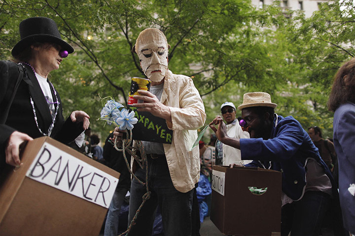 Occupy protests: Members of the Occupy Wall Street movement perform a skit 