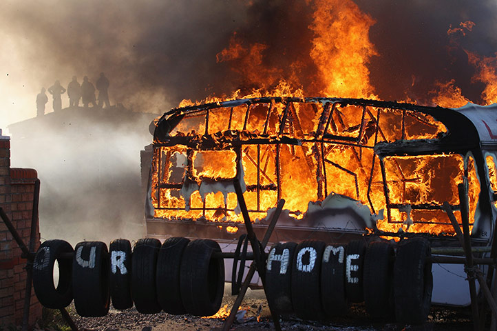 Dale Farm camp: Flames engulf a caravan during evictions from Dale Farm travellers camp