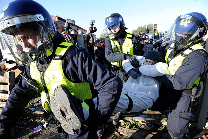 Dale Farm camp: A man is carried away by riot police, Dale Farm