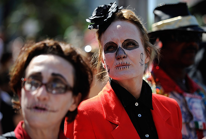 24 hours in pictures: Protesters with painted faces during the Occupy Los Angeles demonstration