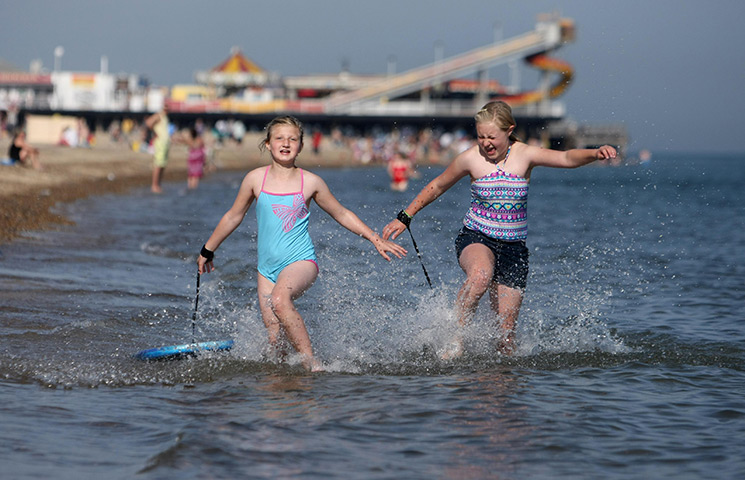 UK October heatwave: Sisters play in the water at Great Yarmouth beach in Norfolk