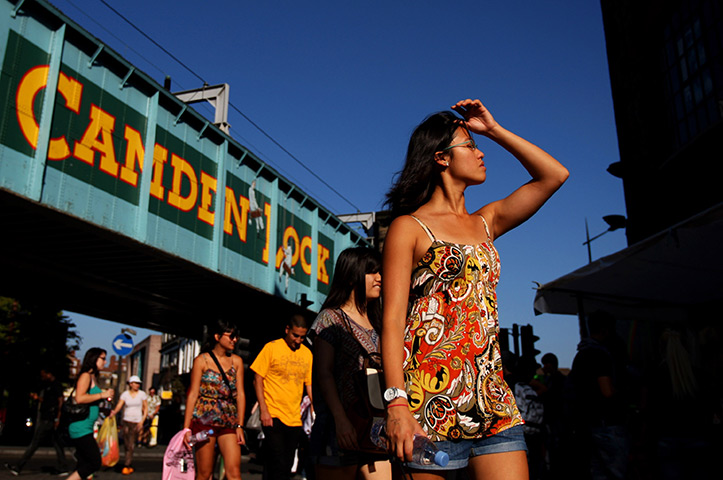 UK October heatwave: People enjoy the sunshine as they walk through Camden Market