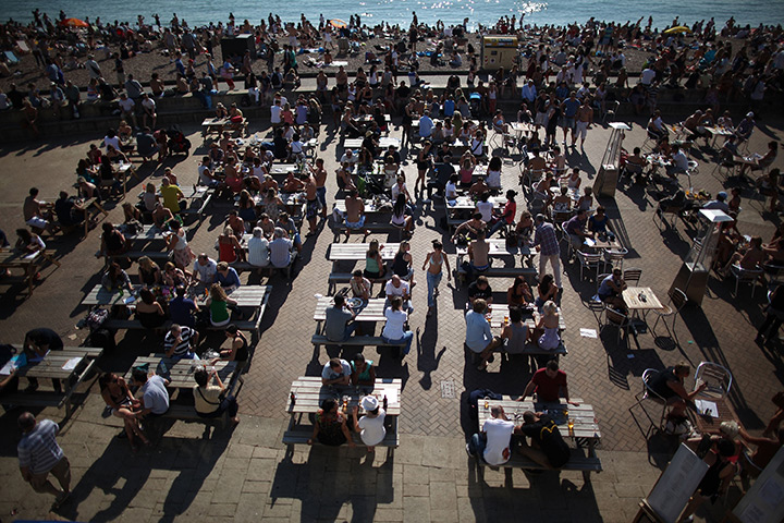 UK October heatwave: People enjoy drinks on the sea front in Brighton