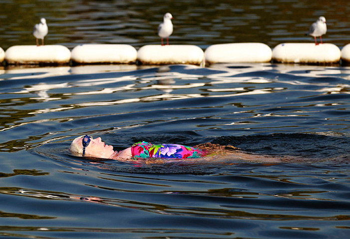 UK October heatwave: A woman swims in the Serpentine in Hyde Park