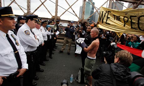 Police square off against protesters on Brooklyn bridge during the Occupy Wall Street march. Photograph: Jessica Rinaldi/Reuters