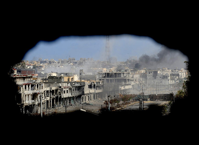 Sirte falls: Smoke billows from the Libyan town of Sirte 