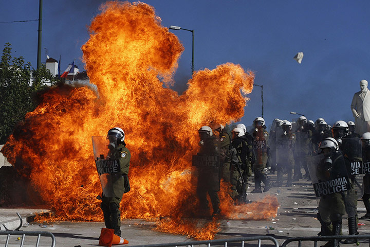 24 hours in pictures: Demonstrators clash with riot police in front of the Greek parliament