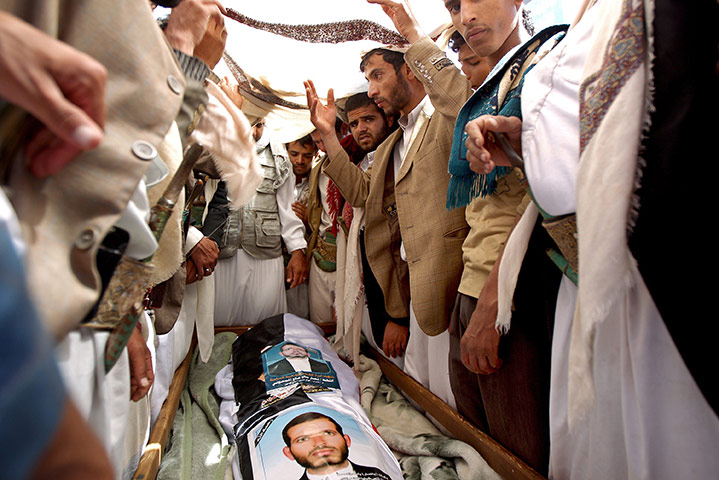24 hours in pictures: Yemeni mourners attend the funeral of 12 anti-government protesters killed 