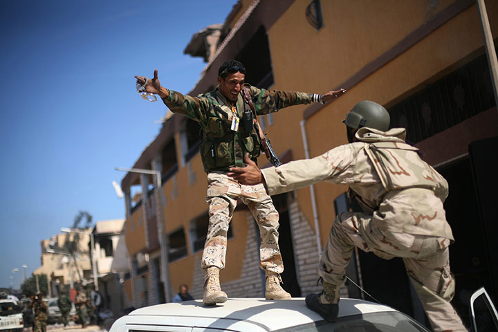 Sirte celebrations: Revolutionary fighters celebrate the capture of Sirte