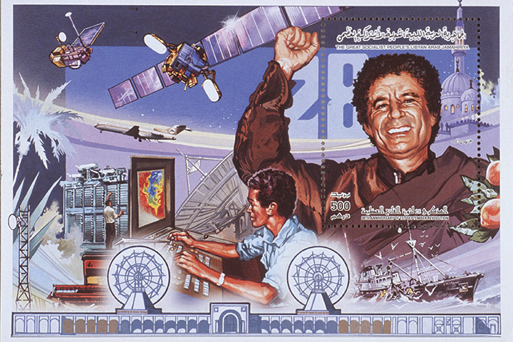 Cult of Gaddafi: A postage stamp portrays Gaddafi as a leader in promoting new technologies