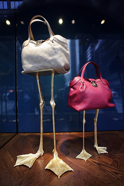Week in Business: Louis Vuitton handbags are displayed in a Bloomingdale's store window