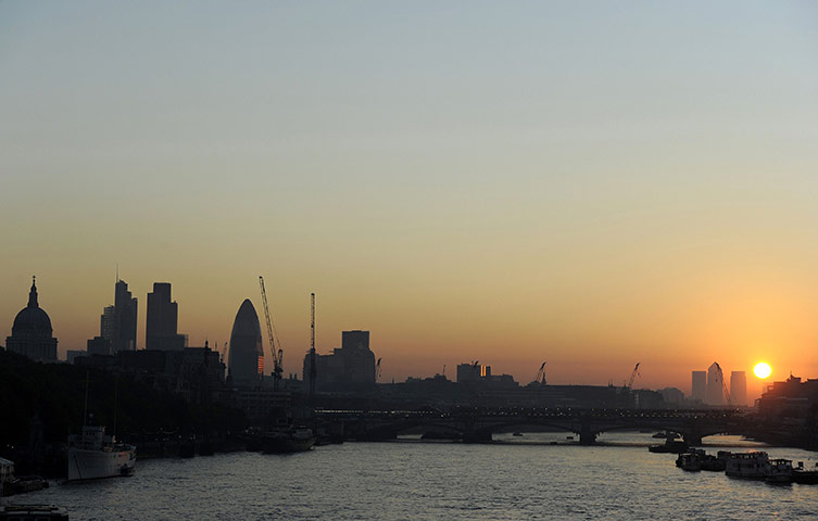 Week in Business: The sun rises behind the Canary Wharf business district