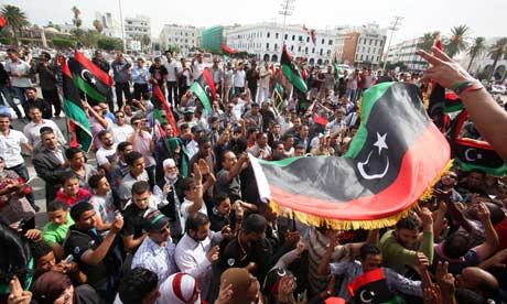 Libyans celebrate the fall of Sirte and the death of Muammar Gaddafi