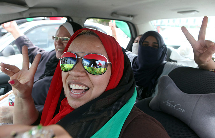 Libya celebrates: Libyan women celebrate the death of Muammar Gaddafi in Tripoli