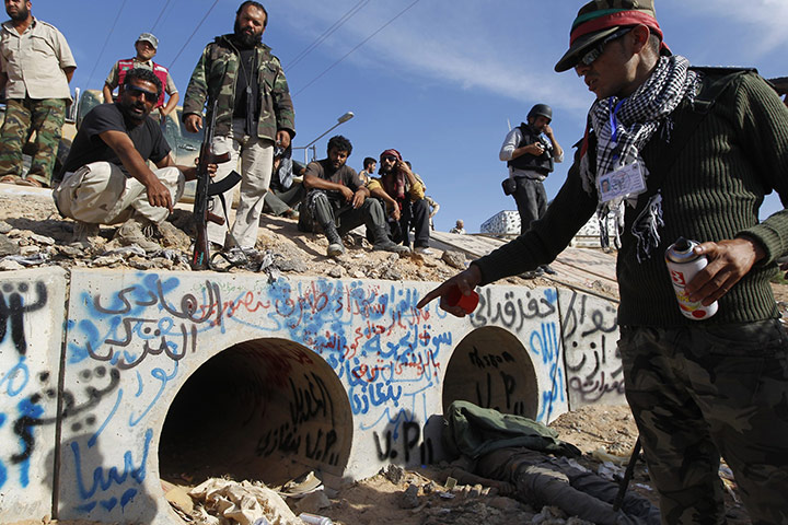 Libya celebrates: Drain where Muammar Gaddafi was hiding before he was captured in Sirte