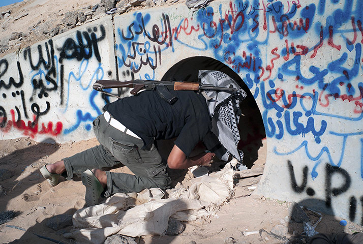 Libya celebrates: Libyan fighter inspects the tunnels where Muammar Gaddafi was found, Sirte