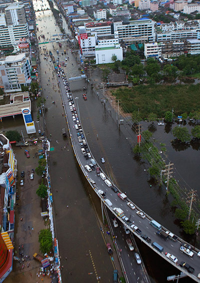 Thailand Floods: cars sit on an elevated roadway