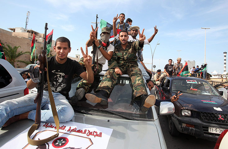 Libya celebrates: Libyans celebrate the fall of Sirte and death of Muammar Gaddafi in Tripoli