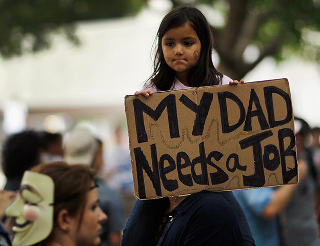Occupy Protests: Miami, Florida: Anabella Campuzano sits on the shoulders of her father