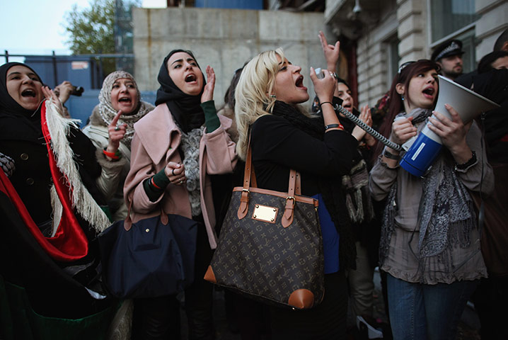 24 hours in pictures: London, UK: Libyan women celebrate outside the embassy in Knightsbridge