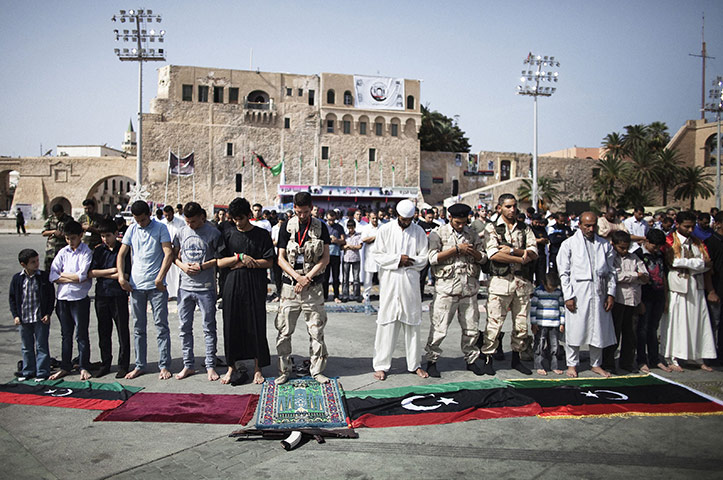 24 Hours: Men at the Friday noon prayer a day after the killing of Muammar Gaddafi