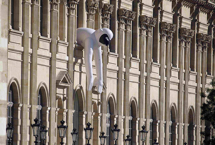 24 Hours: An inflatable sculpture is seen on a facade of the Louvre museum
