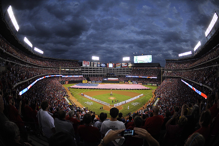 24 hours in pictures: A giant American Flag is unfurled across Rangers Ballpark in Arlington