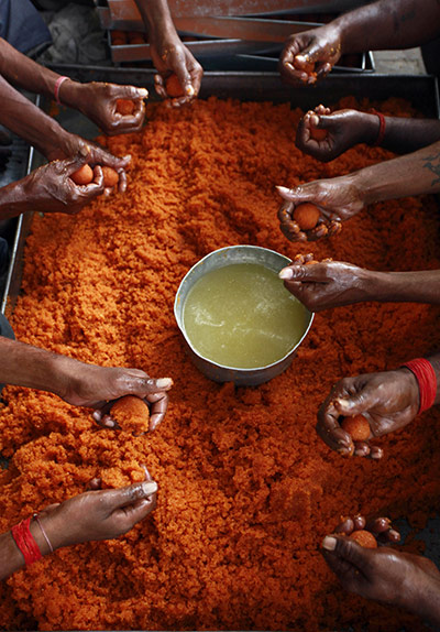 24 hours in pictures: Laddu, a traditional sweet, is prepared at the Hanuman Temple in Allahabad