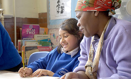 Volunteer helping primary school student