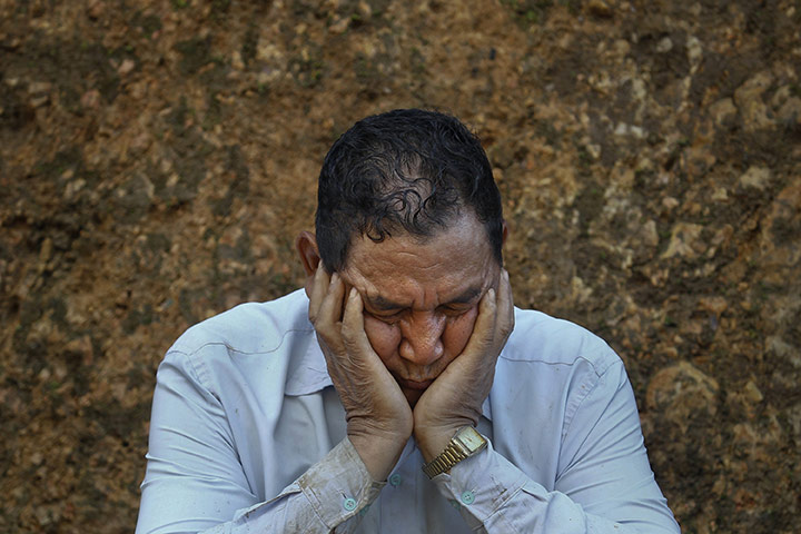 FTA: Adnan Abidi: Ziona, 67, takes a break at the construction site of a church 