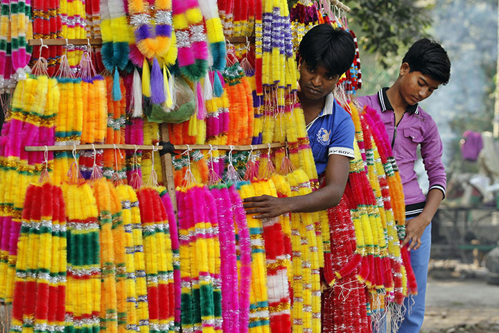 Diwali festival of lights: Indian street vendors sell artificial garlands in Allahabad, India