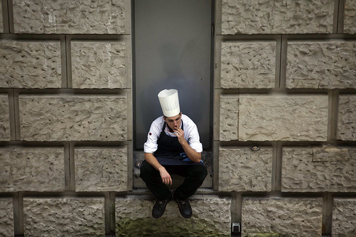 24 hours in pictures: Berlin, Berlin: A cook in a courtyard of the German parliament