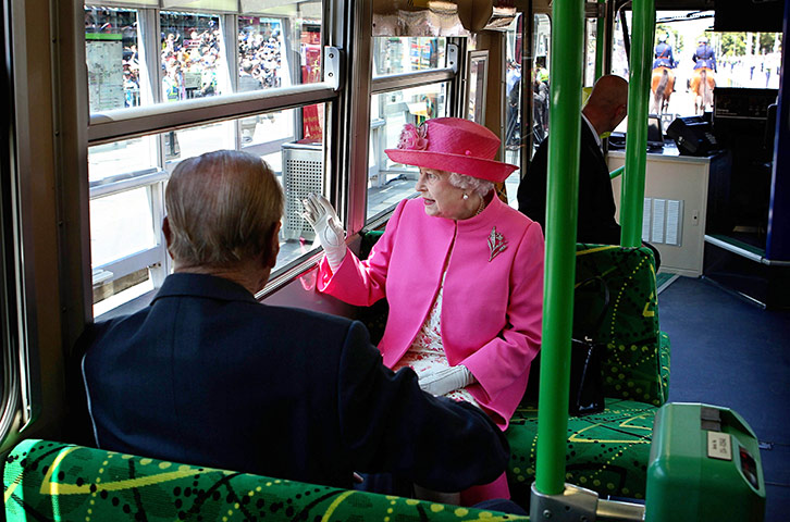 24 hours in pictures: Melbourne, Australia: The Queen and the Duke of Edinburgh ride on a tram