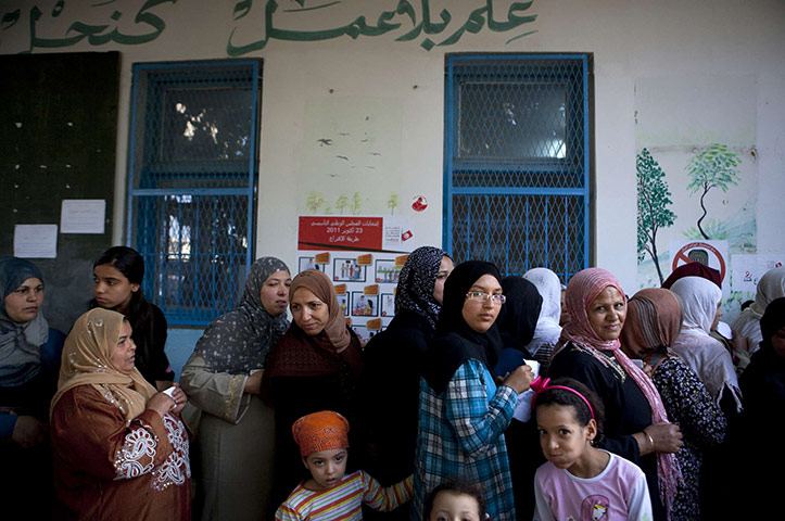Tunisia elections: 23 October: Women queue at a polling station in Tunis