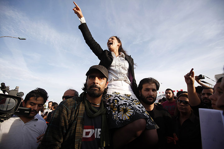 Tunisia elections: 25 October: A demonstrator shouts during a protest 
