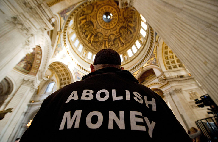 St Paul's reopens: A protester stands beneath the dome
