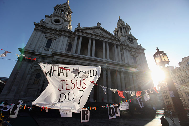 St Paul's reopens: Banners placed by campaigners