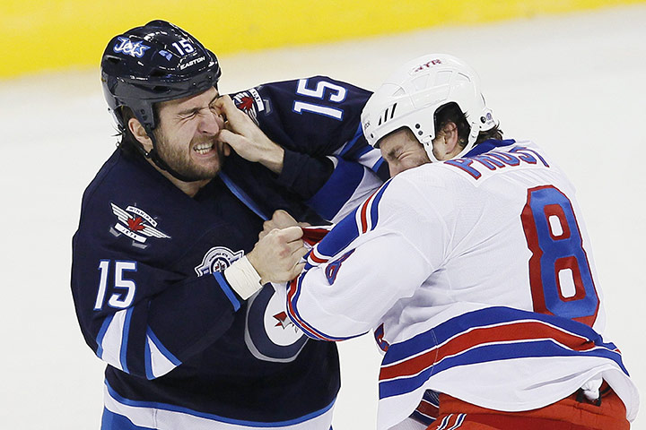 The week in sport: Winnipeg Jets' Tanner Glass fights with New York Rangers' Brandon Prust