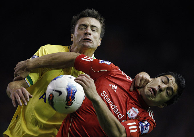 The week in sport: Liverpool's Luis Suarez tussles with Norwich City's Russell Martin 