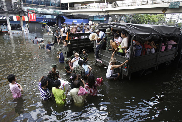 Bangkok: Local residents evacuate from their neighbourhood on a Thai army truck