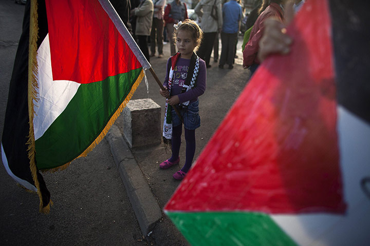 24 hours: A girl holds a Palestinian flag at a protest in East Jerusalem