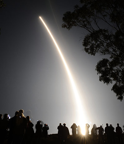 24 hours: Spectators watch as a Delta II rocket launches