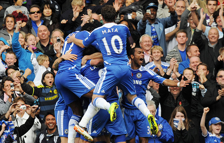 Premiership Roundup: Chelsea players celebrate captain John Terry's goal 