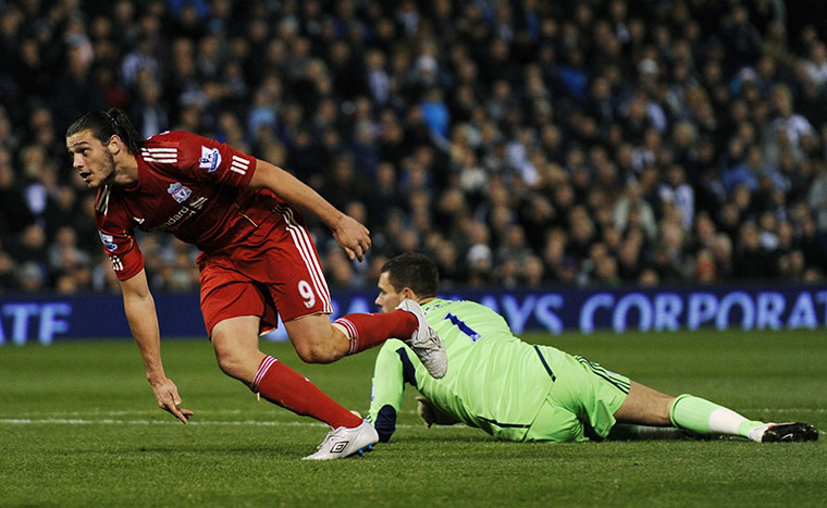 Premier League roundup: Andy Carroll celebrates scoring the second goal for Liverpool against West Bromwich Albion