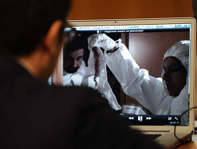 Amanda Knox trial: 27 September 2011: A forensic technician looks at a police video