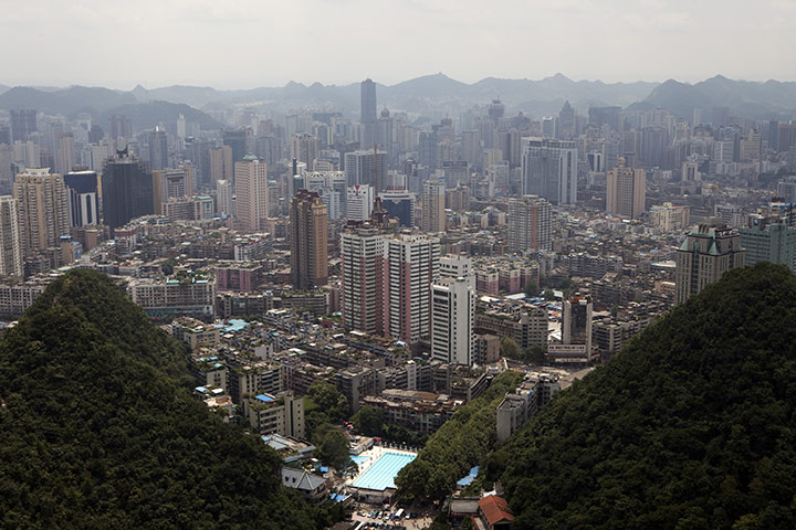 Guiyang urbanisation: A view of the city of Guiyang from the top of QianLing Mountain