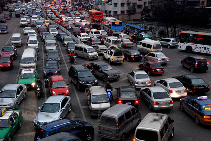 Guiyang urbanisation: Vehicles drive slowly in a traffic jam in Guiyang, Guizhou