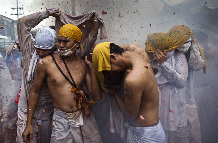 24 hours in pictures: Phuket, Thailand: Devotees to the Chinese shrine of Jui Tui